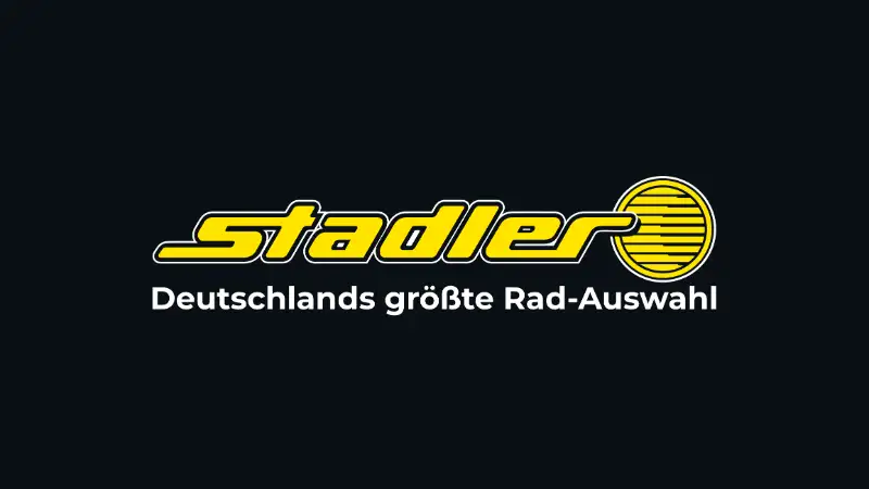 Das Logo von Zweirad Stadler. Gelber Schriftzug mit dem Namen "Stadler" und darunter der Text "Deutschlands größte Rad-Auswahl".